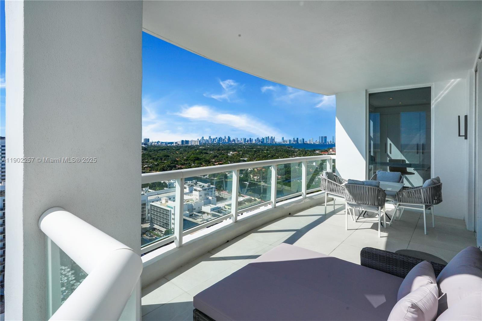 4201 Collins Avenue, Unit 2101 Miami Beach, FL 33140 - Photo 26 of 50 a view of balcony with furniture and a potted plant