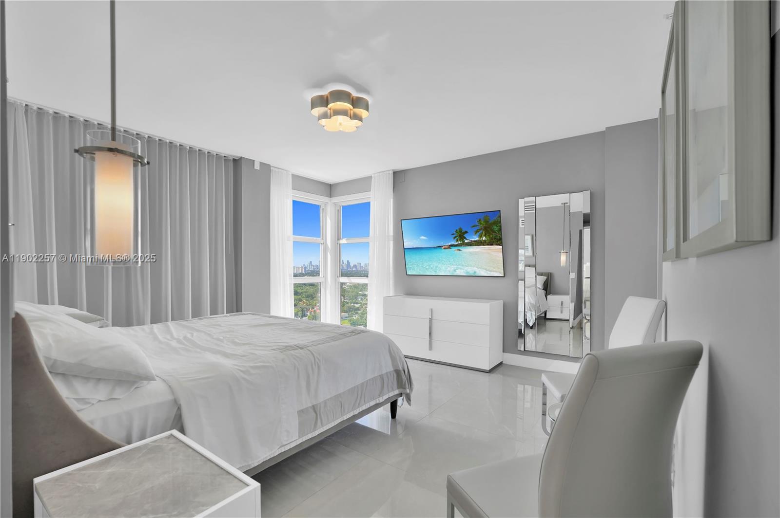 4201 Collins Avenue, Unit 2101 Miami Beach, FL 33140 - Photo 29 of 50 a bedroom with a bed and a table