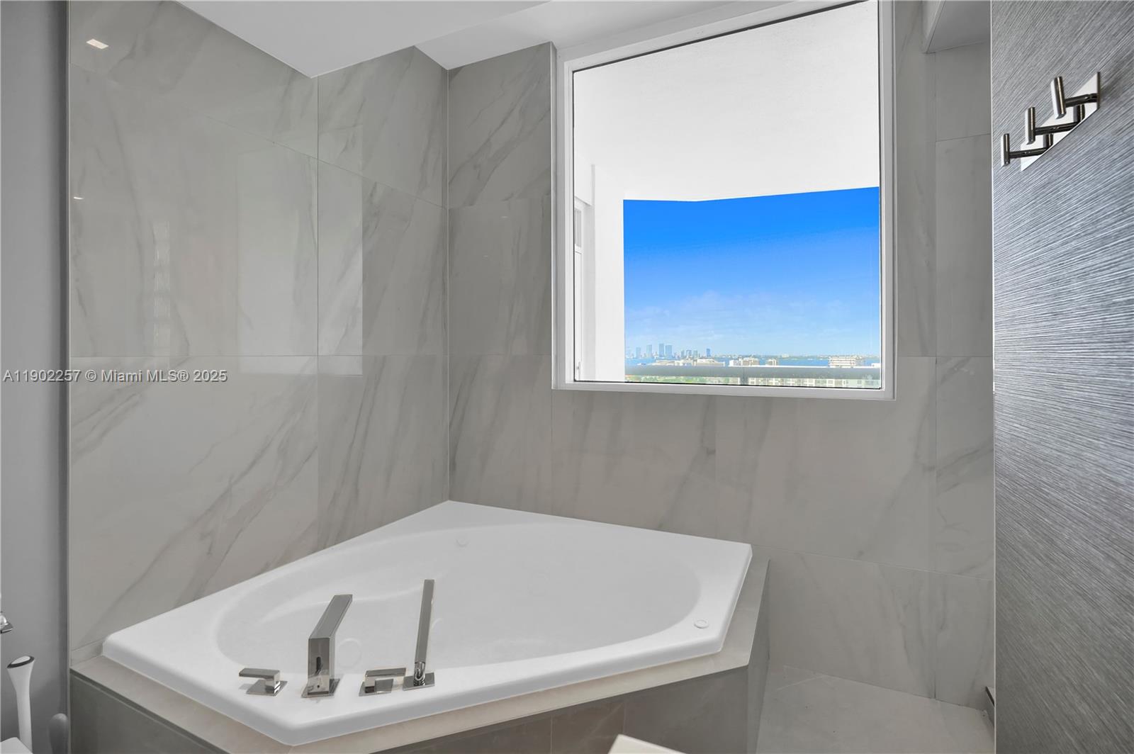 4201 Collins Avenue, Unit 2101 Miami Beach, FL 33140 - Photo 34 of 50 a bathroom with a tub
