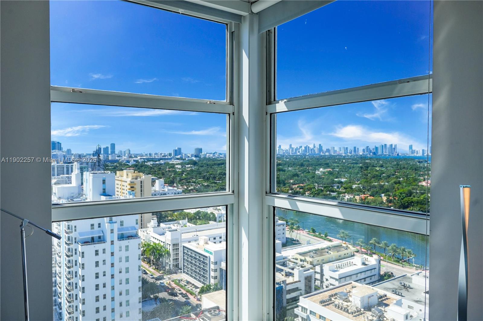 4201 Collins Avenue, Unit 2101 Miami Beach, FL 33140 - Photo 40 of 50 a view of a glass door with a floor to ceiling window next to a yard