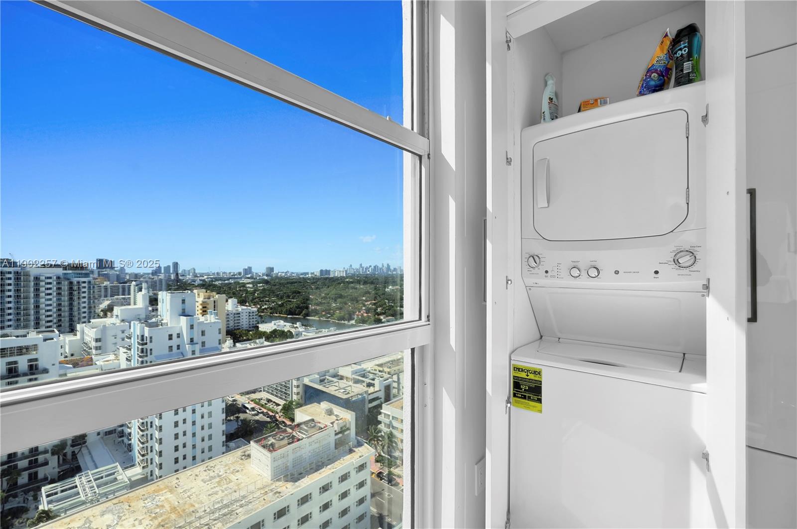 4201 Collins Avenue, Unit 2101 Miami Beach, FL 33140 - Photo 41 of 50 a utility room with dryer and washer
