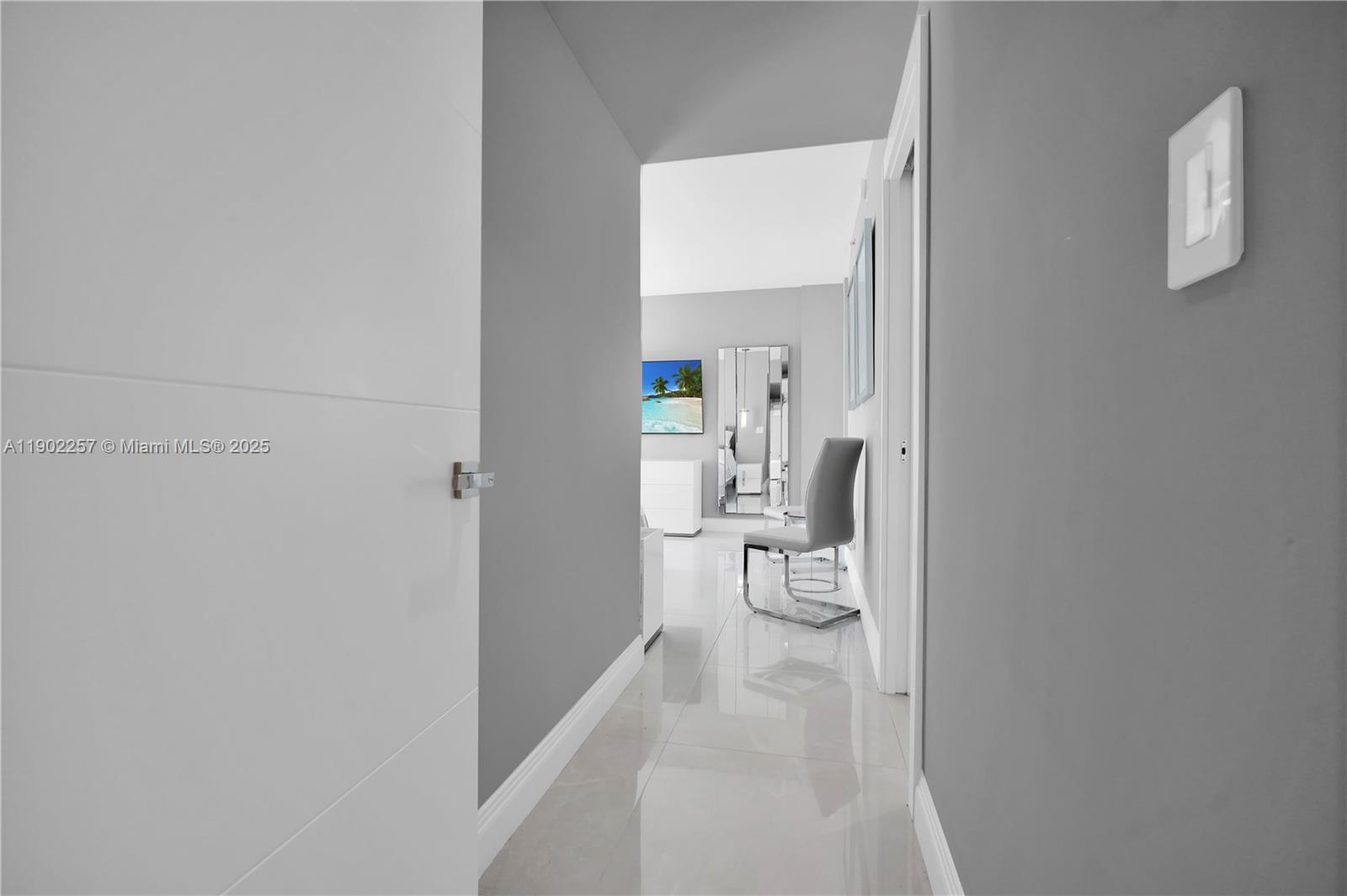 4201 Collins Avenue, Unit 2101 Miami Beach, FL 33140 - Photo 48 of 50 a view of a room with wooden floor a bathroom and sink