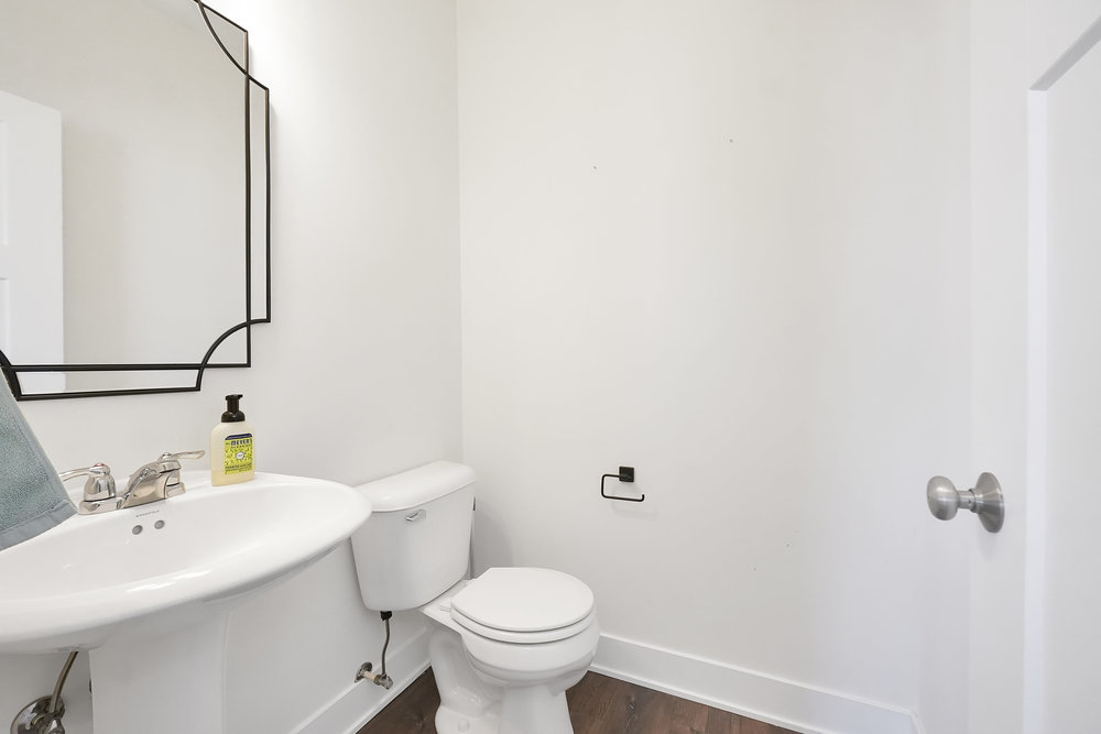 4133 Calder Lane Aurora, IL 60504 - Photo 11 of 38 a bathroom with a sink a toilet and a mirror