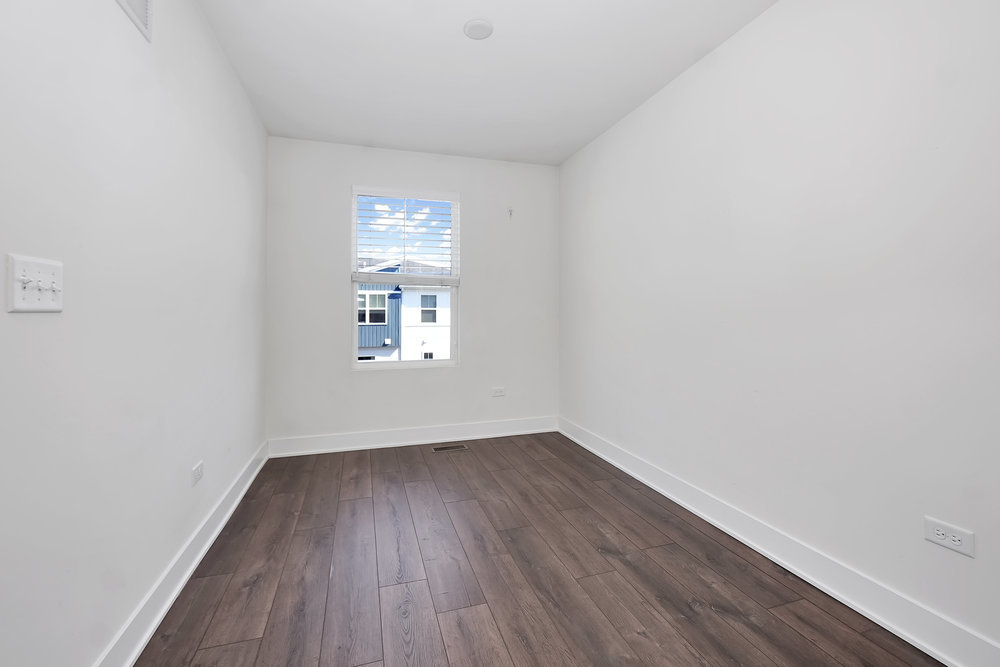4133 Calder Lane Aurora, IL 60504 - Photo 12 of 38 a view of a small space with wooden floor and a window