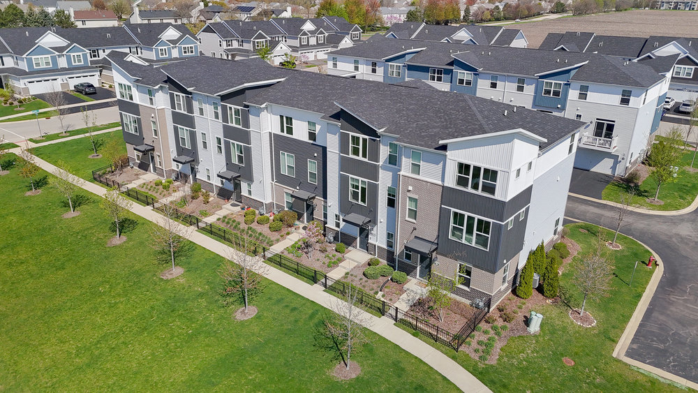 4133 Calder Lane Aurora, IL 60504 - Photo 2 of 38 an aerial view of residential houses with outdoor space and swimming pool