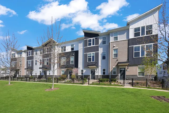 front view of a brick house with a large windows