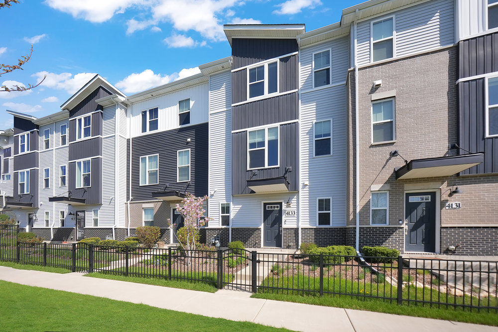4133 Calder Lane Aurora, IL 60504 - Photo 25 of 38 a front view of multiple houses with yard