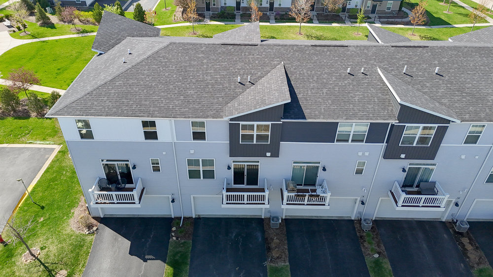 4133 Calder Lane Aurora, IL 60504 - Photo 27 of 38 an aerial view of multiple houses with a yard
