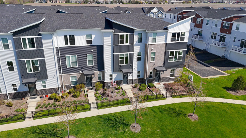 4133 Calder Lane Aurora, IL 60504 - Photo 38 of 38 a front view of multiple houses with yard