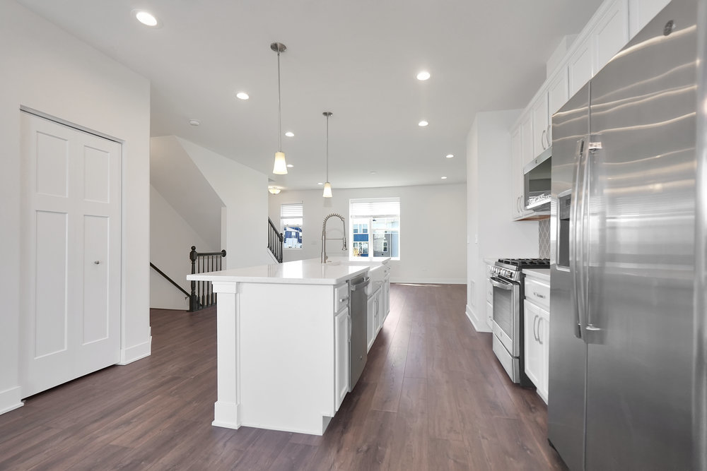 4133 Calder Lane Aurora, IL 60504 - Photo 5 of 38 a kitchen with a sink and refrigerator