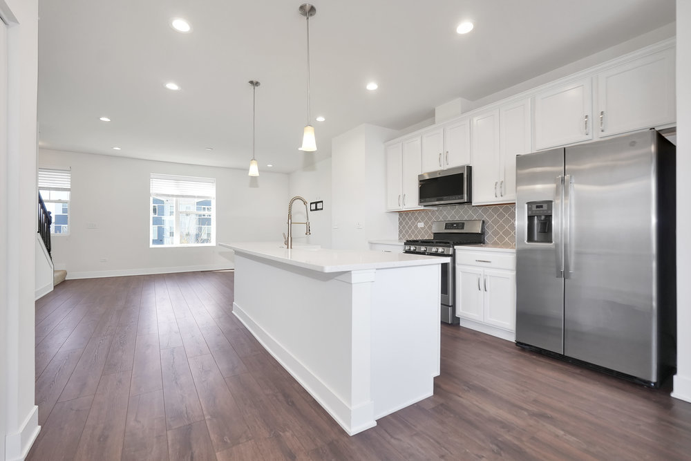 4133 Calder Lane Aurora, IL 60504 - Photo 6 of 38 a kitchen with refrigerator and microwave