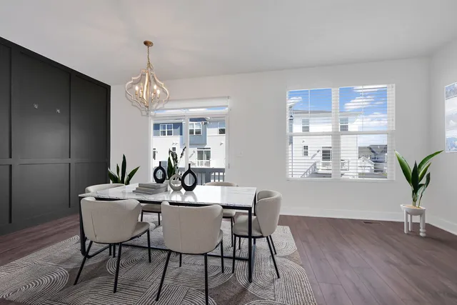 a view of a dining room with furniture window and wooden floor