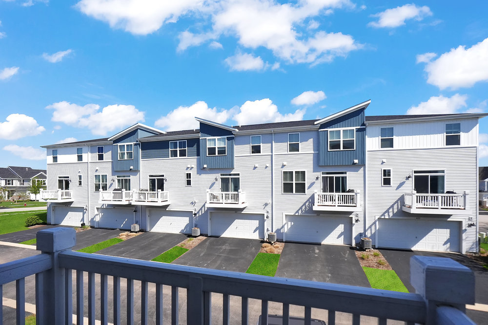 4133 Calder Lane Aurora, IL 60504 - Photo 10 of 38 a view of a patio with couches chairs potted plants and wooden fence