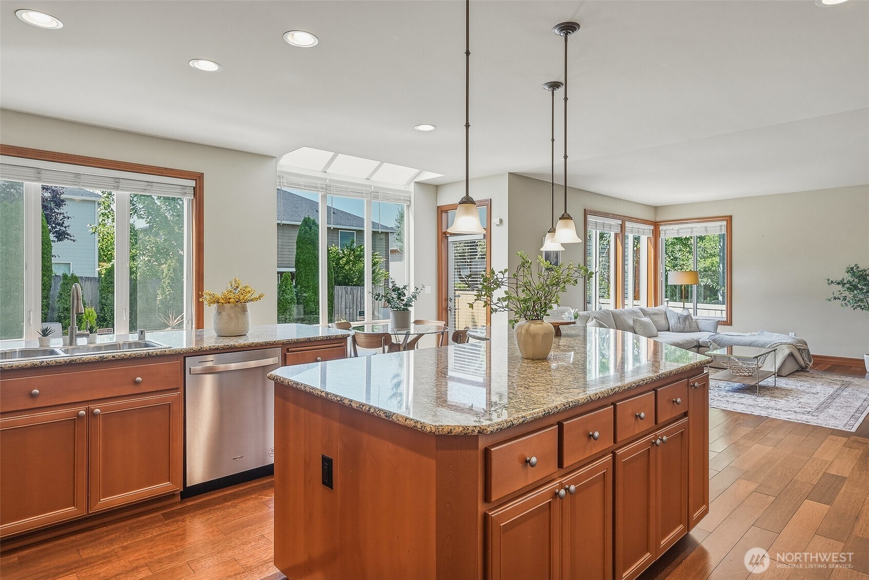 3932 221st Place Southeast Bothell, WA 98021 - Photo 16 of 36 a kitchen with center island and windows