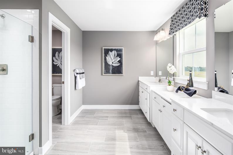 3510 Wildview Lane York, PA 17404 - Photo 13 of 17 a spacious bathroom with double vanity a mirror and a shower