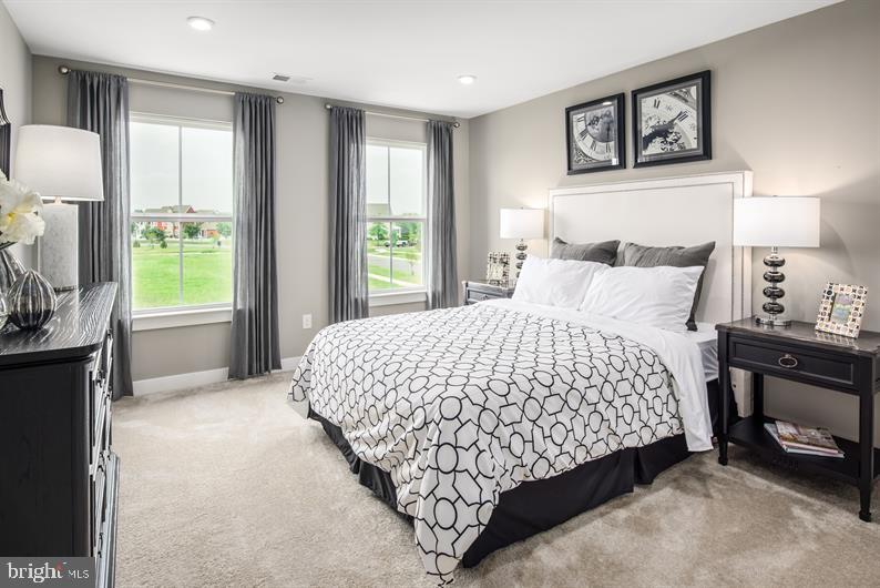 3510 Wildview Lane York, PA 17404 - Photo 15 of 17 a bedroom with a bed lamps and window