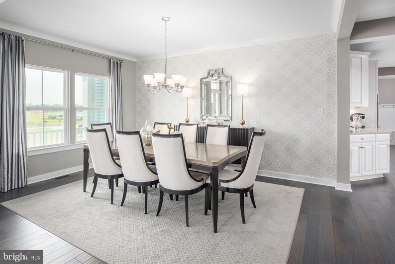 3510 Wildview Lane York, PA 17404 - Photo 2 of 17 a dining room with furniture a chandelier and wooden floor