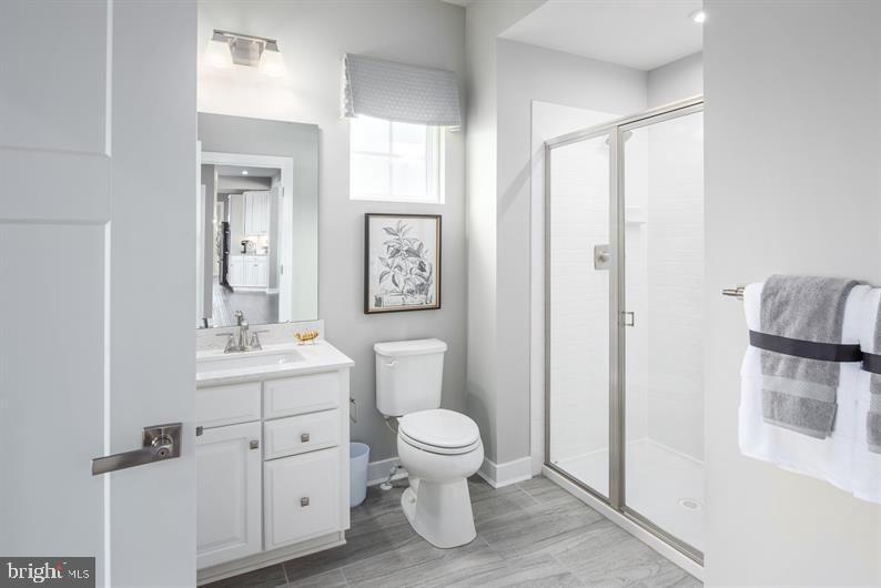 3510 Wildview Lane York, PA 17404 - Photo 6 of 17 a bathroom with a toilet a sink and a mirror