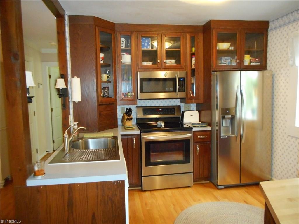 2301 Farmgate Road Browns Summit, NC 27214 - Photo 12 of 19 Kitchen is open to the dining area
