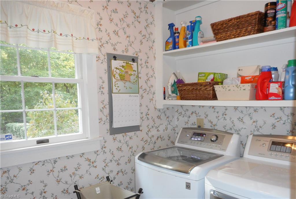 2301 Farmgate Road Browns Summit, NC 27214 - Photo 15 of 19 Laundry room is bight and sunny. Adjacent pantry has great storage