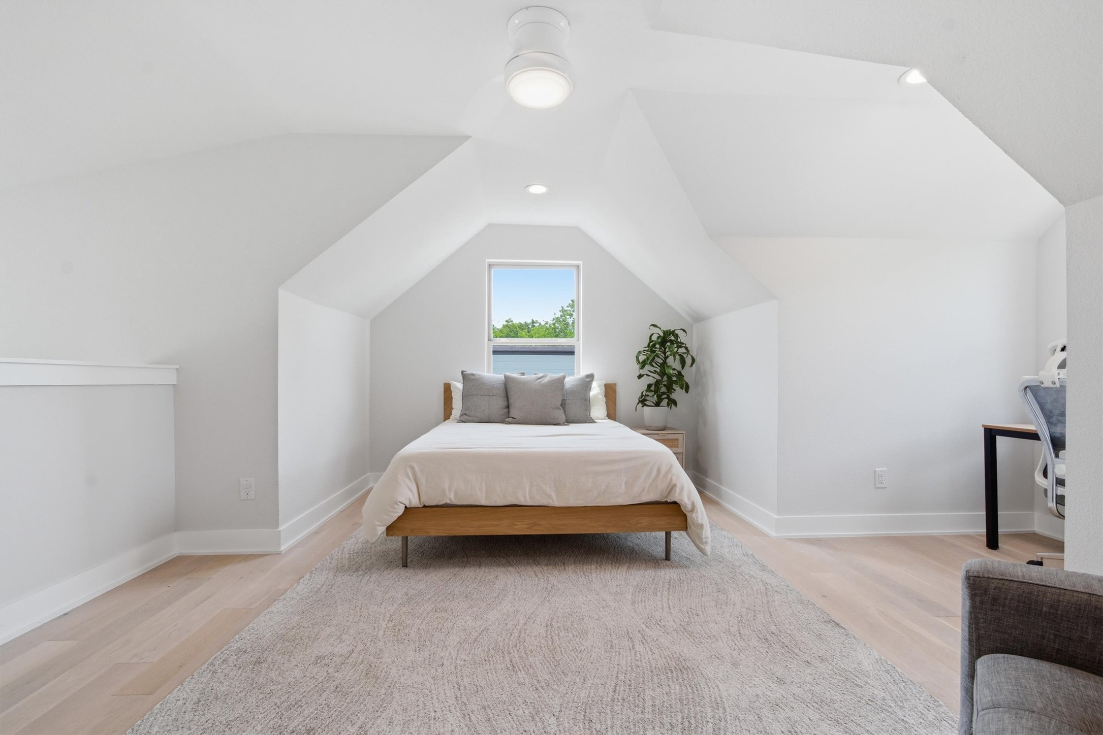 2710 Zaragosa Street, Unit A Austin, TX 78702 - Photo 24 of 29 Top-floor Loft Suite with vaulted ceilings and natural light — a true retreat with the most separation in the home.