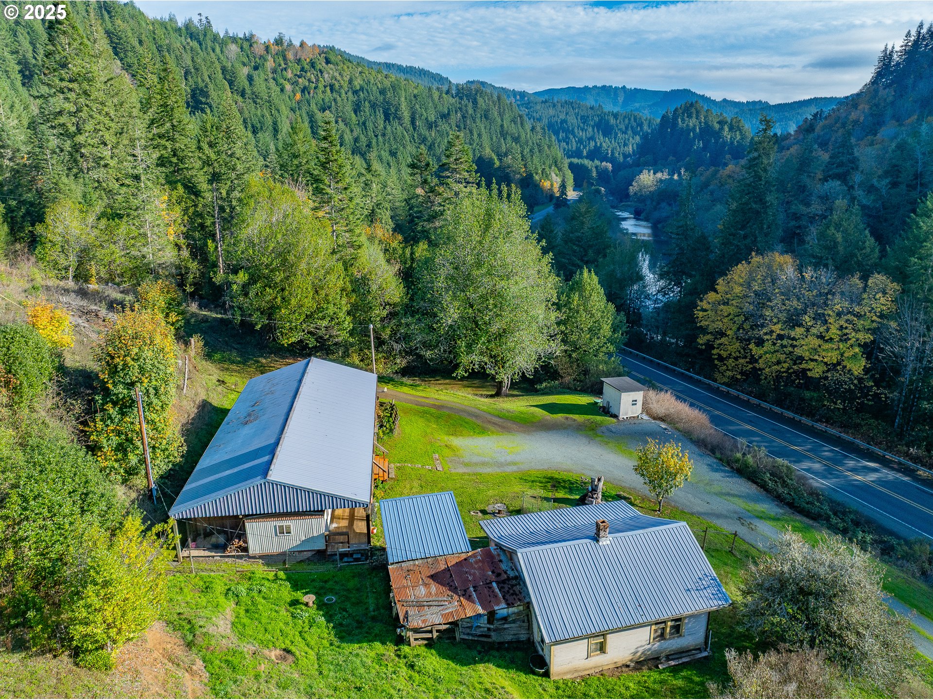 15779 Highway 42 Myrtle Point, OR 97458 - Photo 25 of 33 an aerial view of a house with swimming pool garden and patio