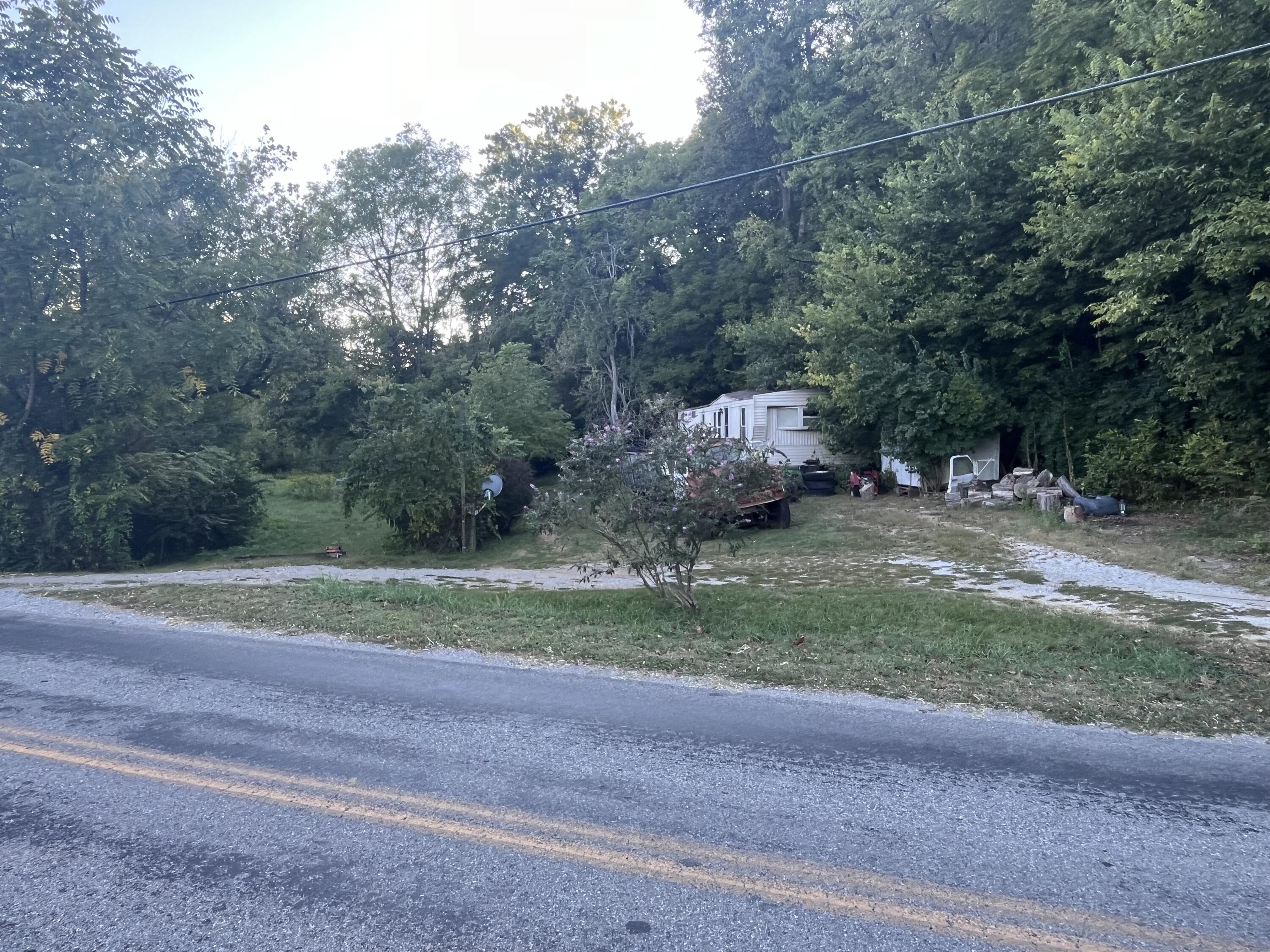 229 Mt Joy Road Buchanan, VA 24066 - Photo 9 of 11 a backyard of a house with oven and outdoor seating