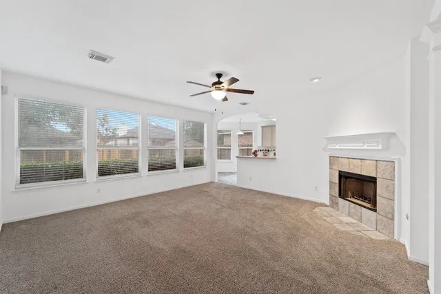 a view of an empty room with a fireplace