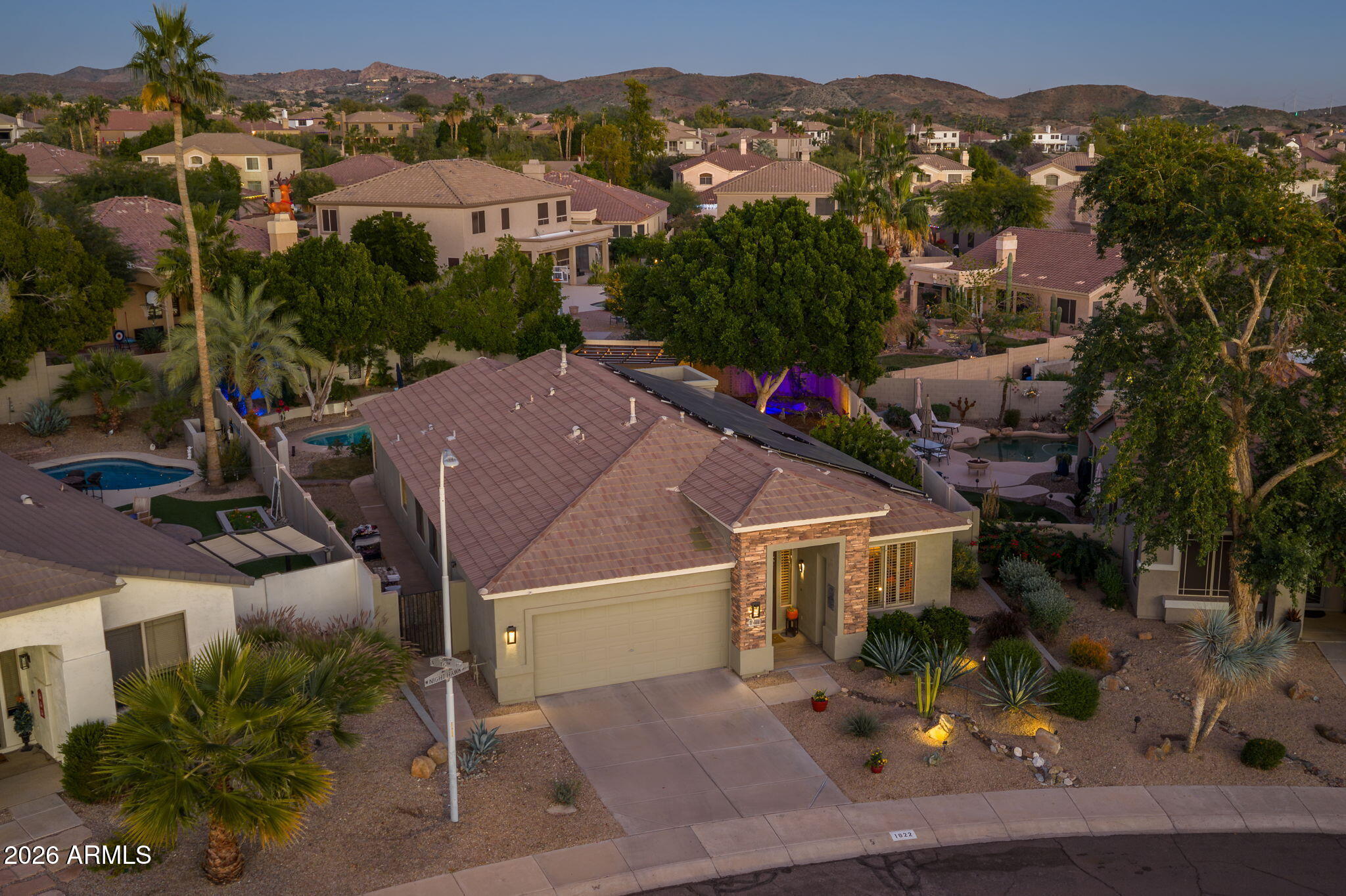 a aerial view of a house with a yard