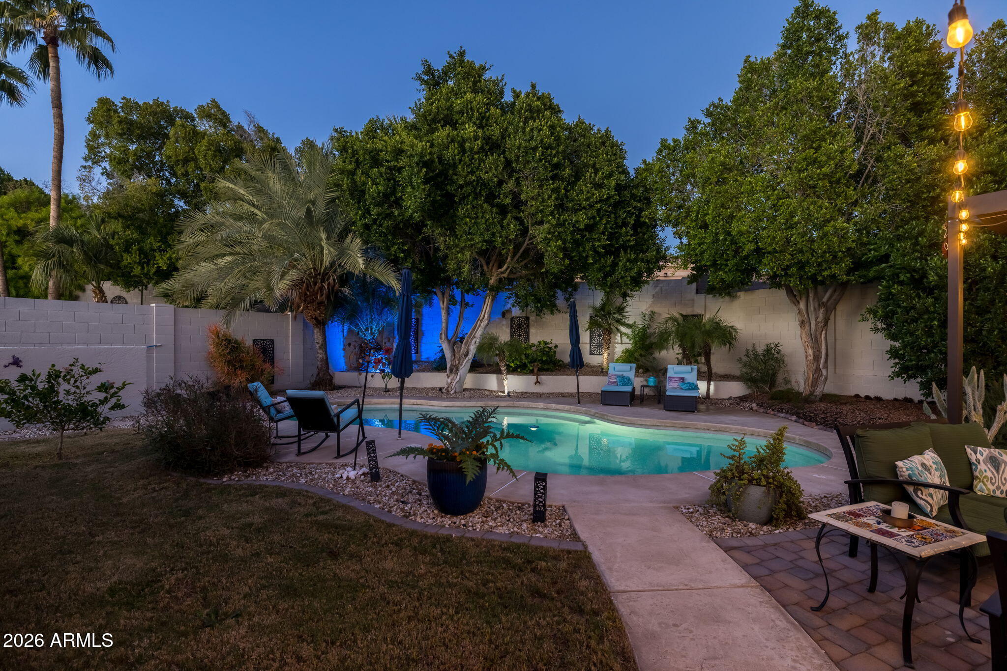 1622 West Nighthawk Way Phoenix, AZ 85045 - Photo 2 of 70 a view of a table and chairs in backyard of the house