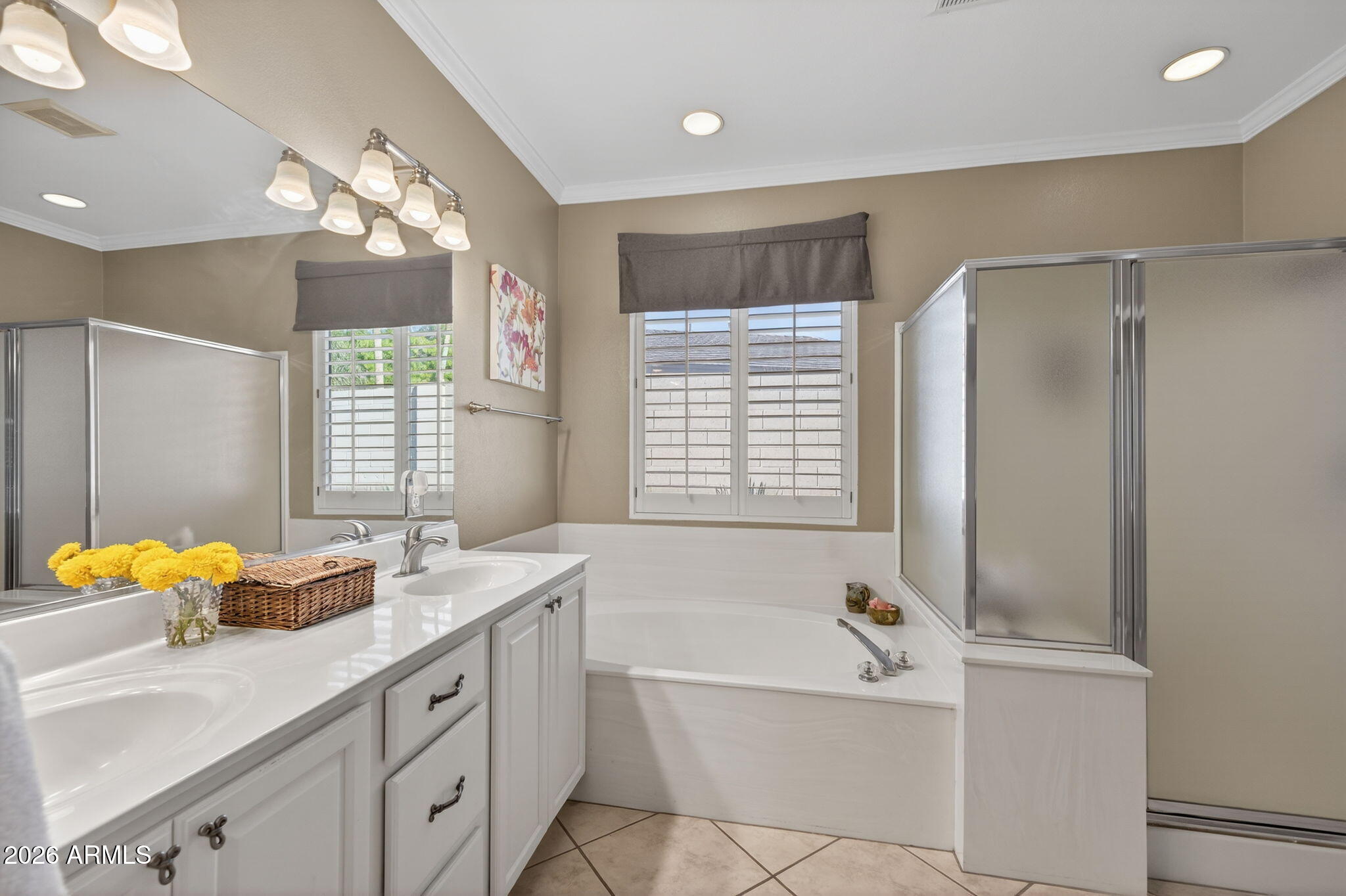 1622 West Nighthawk Way Phoenix, AZ 85045 - Photo 35 of 70 a bathroom with a tub sink and mirror