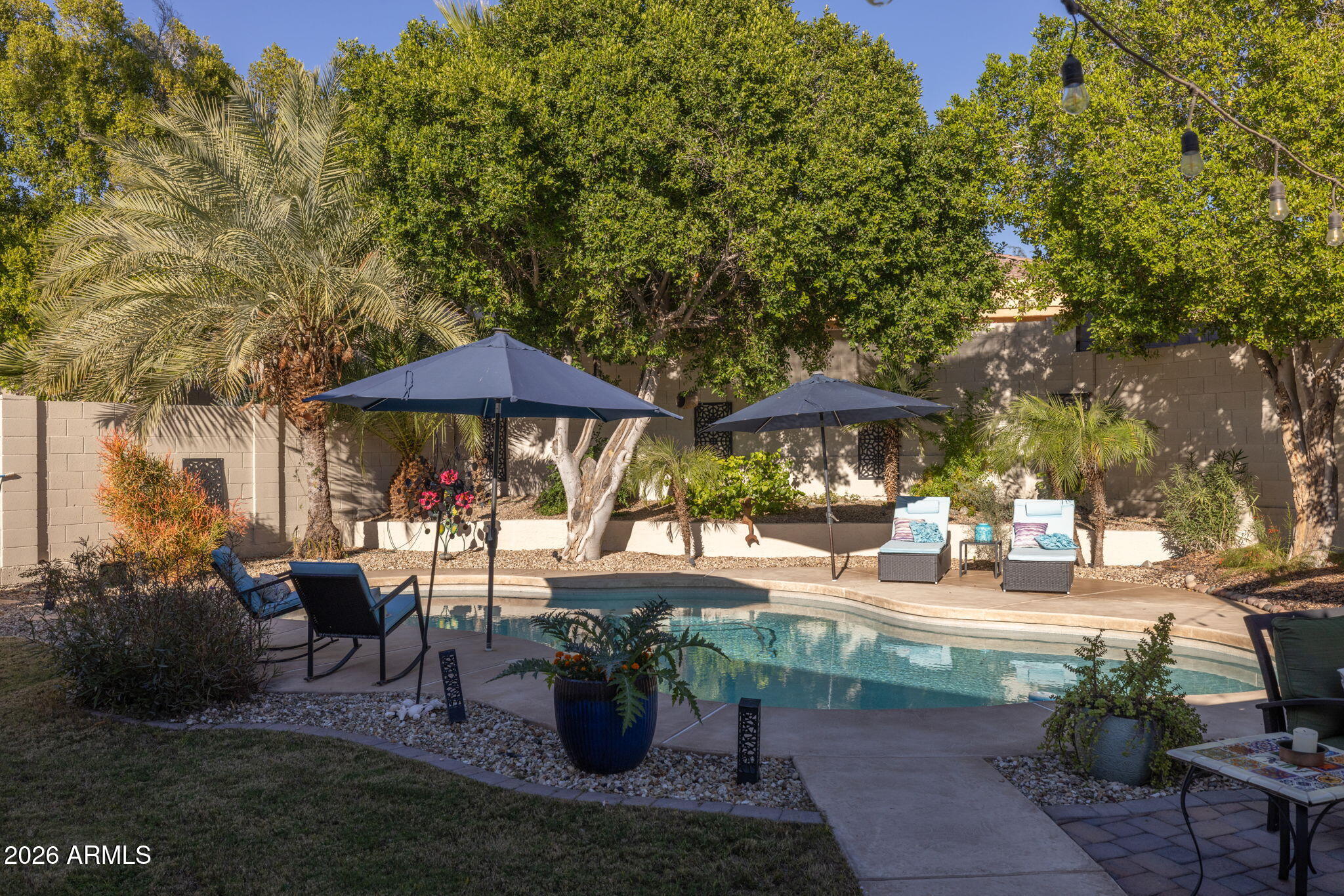 1622 West Nighthawk Way Phoenix, AZ 85045 - Photo 43 of 70 a view of backyard with outdoor seating and trees