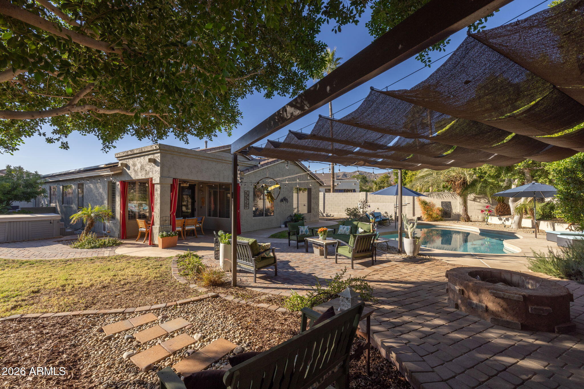 1622 West Nighthawk Way Phoenix, AZ 85045 - Photo 47 of 70 a view of a backyard with sitting area