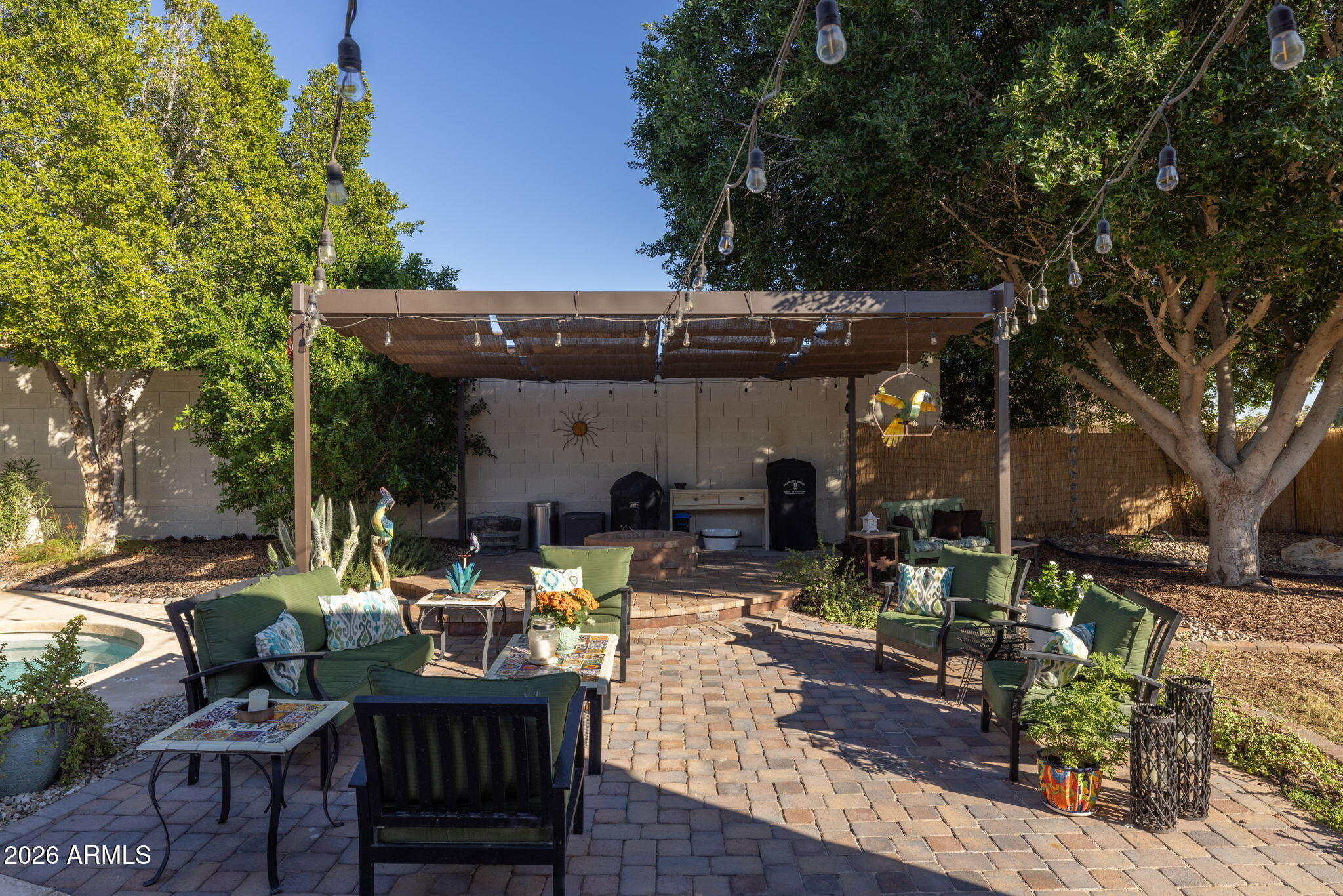 1622 West Nighthawk Way Phoenix, AZ 85045 - Photo 49 of 70 a view of a patio with table and chairs and potted plants