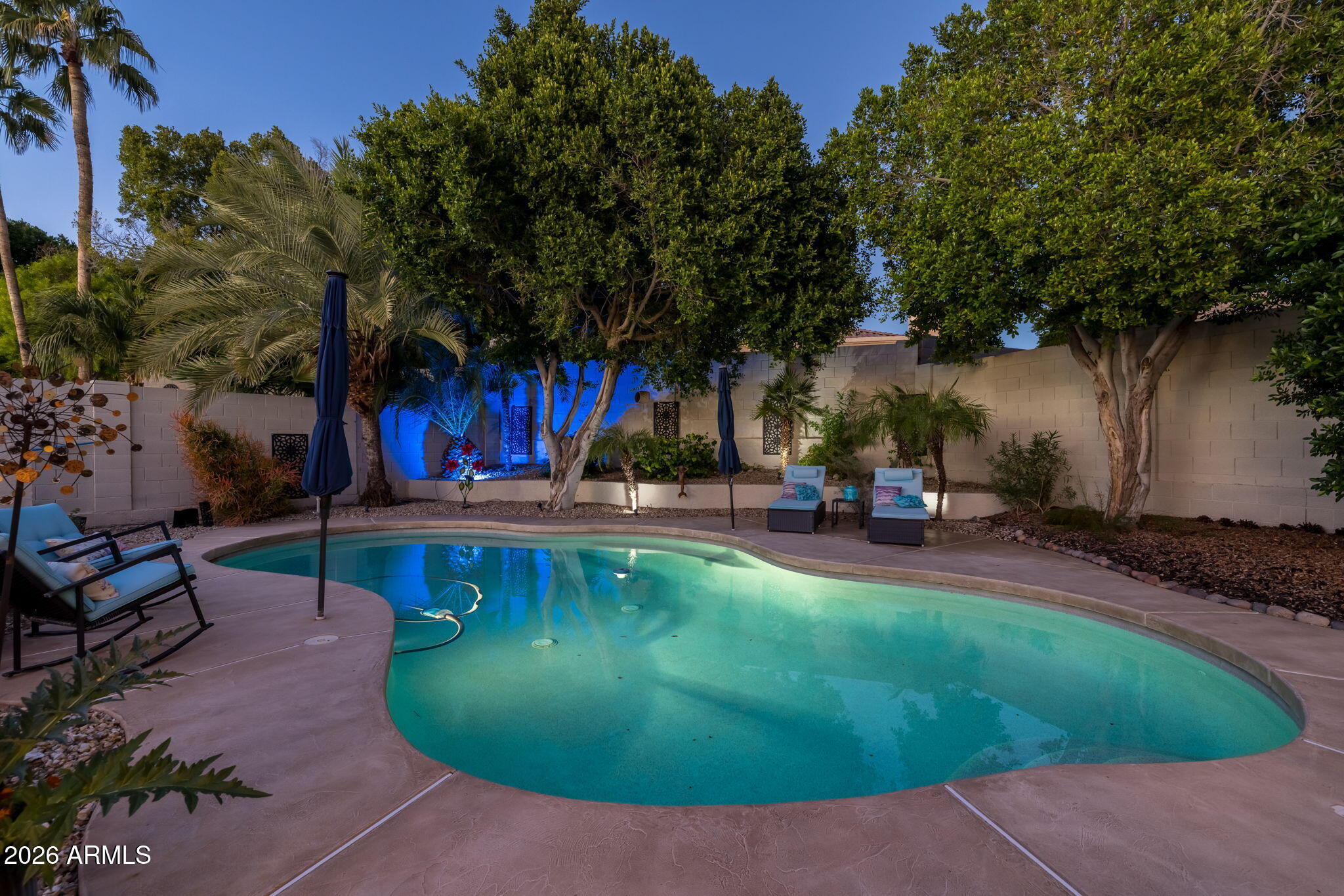 1622 West Nighthawk Way Phoenix, AZ 85045 - Photo 53 of 70 a view of a swimming pool with sitting area