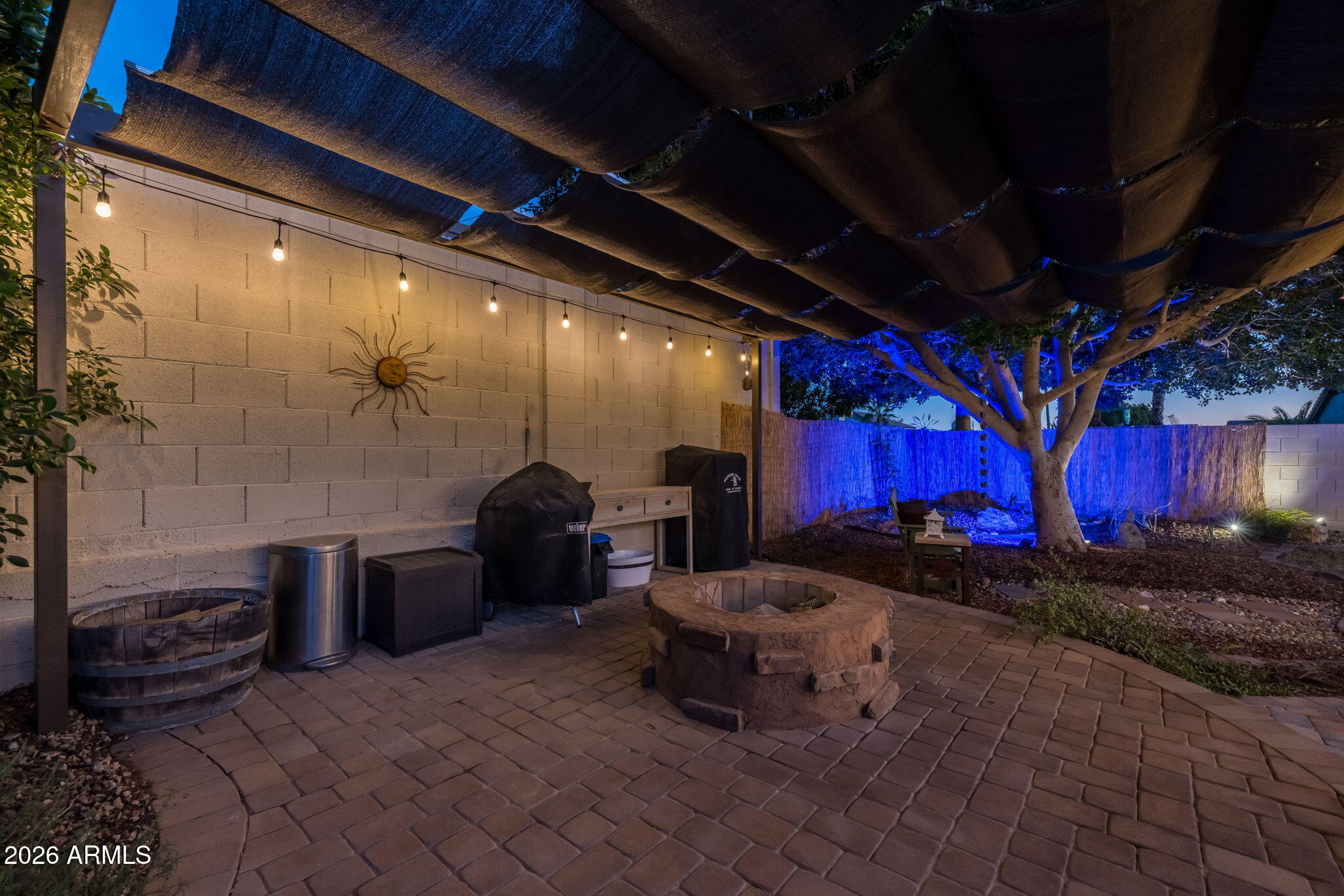 1622 West Nighthawk Way Phoenix, AZ 85045 - Photo 55 of 70 a couple of chairs sitting in patio with red umbrella