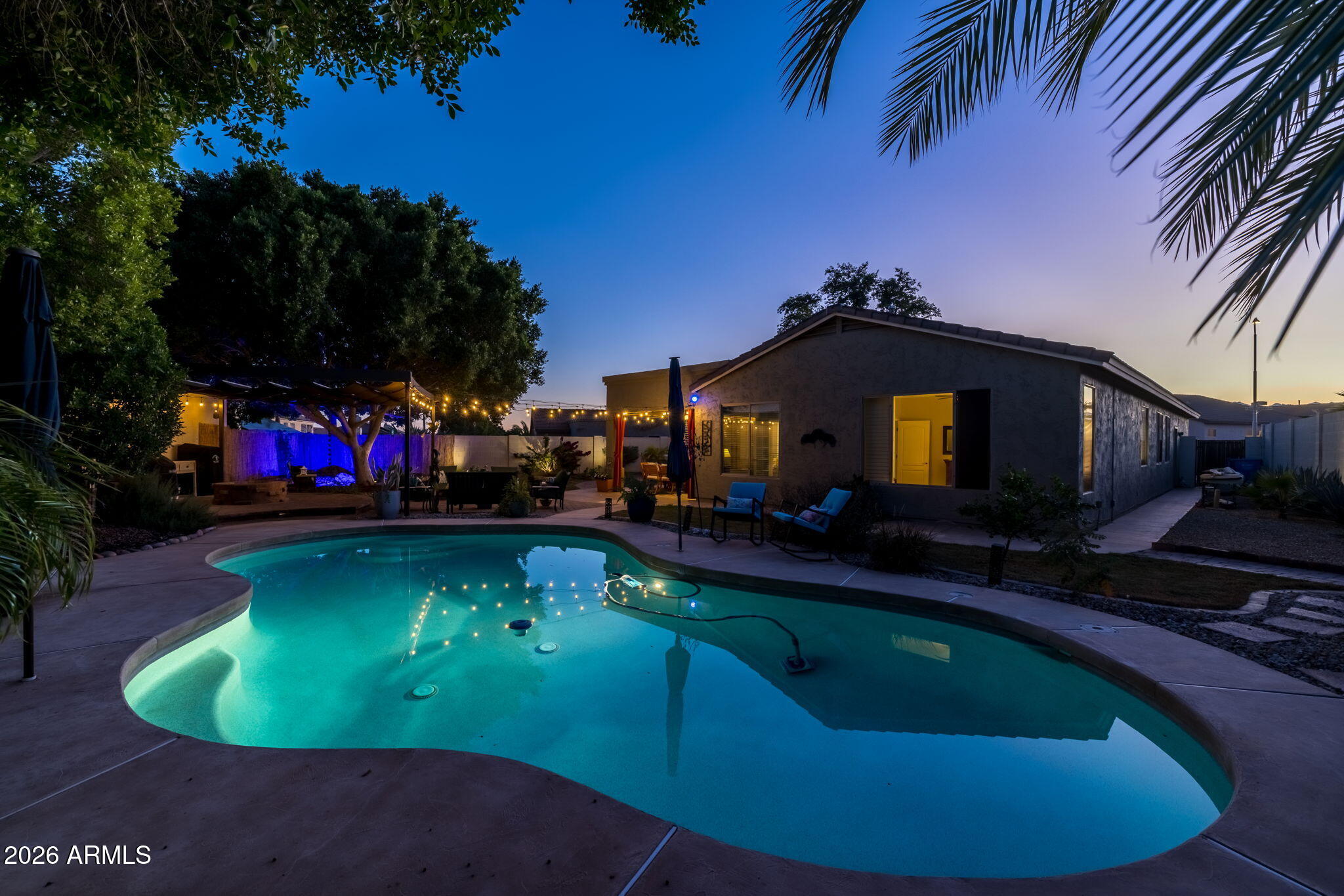 1622 West Nighthawk Way Phoenix, AZ 85045 - Photo 60 of 70 a view of a swimming pool with a yard