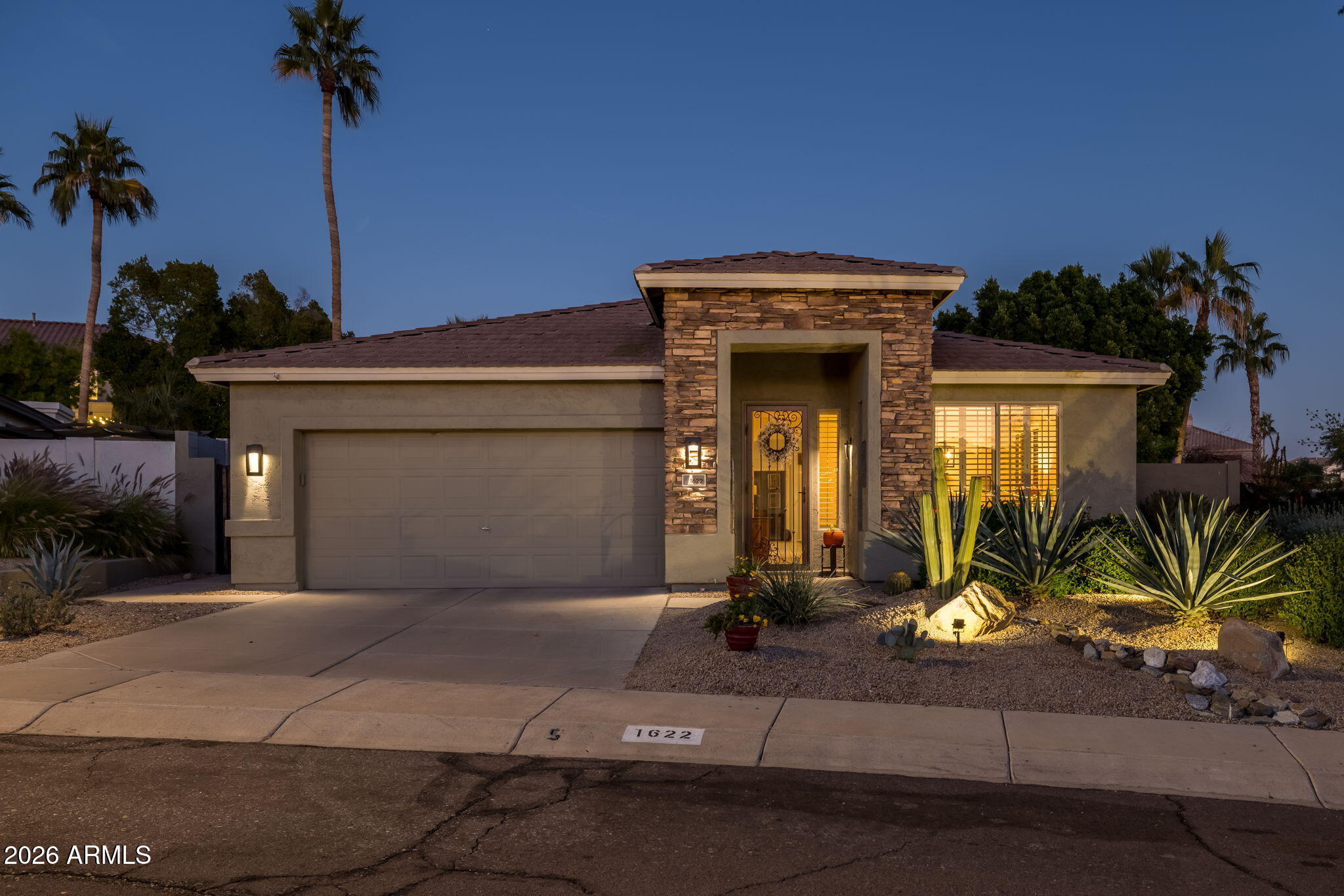 1622 West Nighthawk Way Phoenix, AZ 85045 - Photo 10 of 70 a front view of a house with a yard