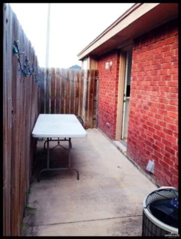 a table and chairs in front of door