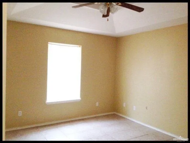 a view of empty room with a window