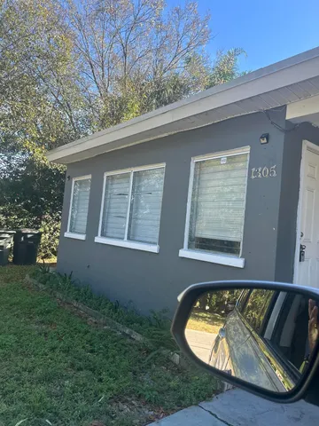 a view of a small pool with a yard
