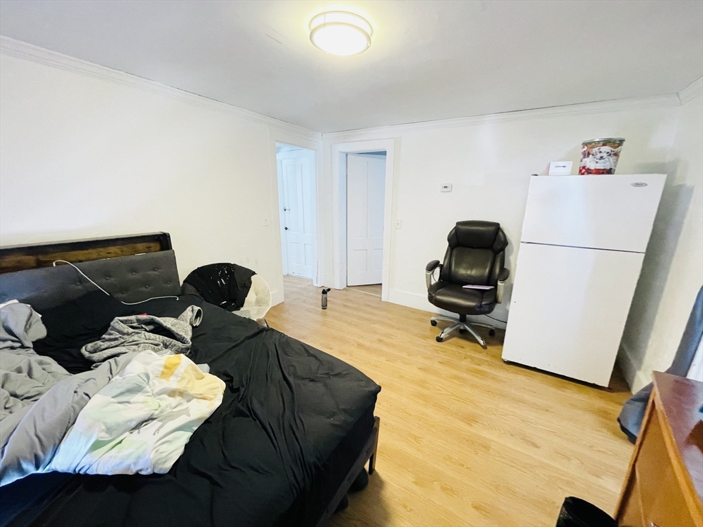 92 Mill Street Lancaster, MA 01523 - Photo 13 of 26 a bedroom with furniture and a bed