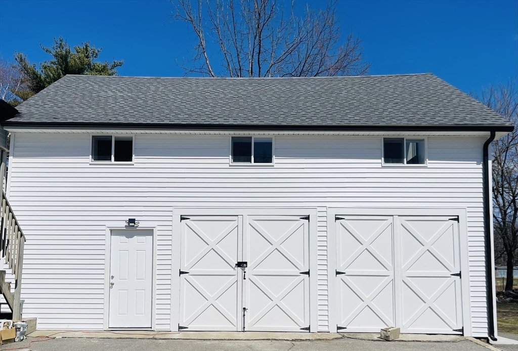 92 Mill Street Lancaster, MA 01523 - Photo 17 of 26 a house with wooden fence