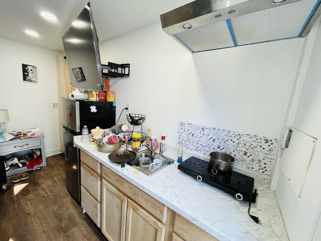 92 Mill Street Lancaster, MA 01523 - Photo 19 of 26 a view of storage and utility room with toys