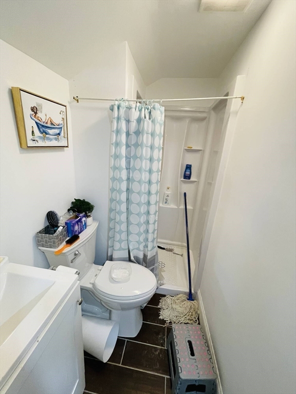 92 Mill Street Lancaster, MA 01523 - Photo 20 of 26 a bathroom with a sink toilet and shower
