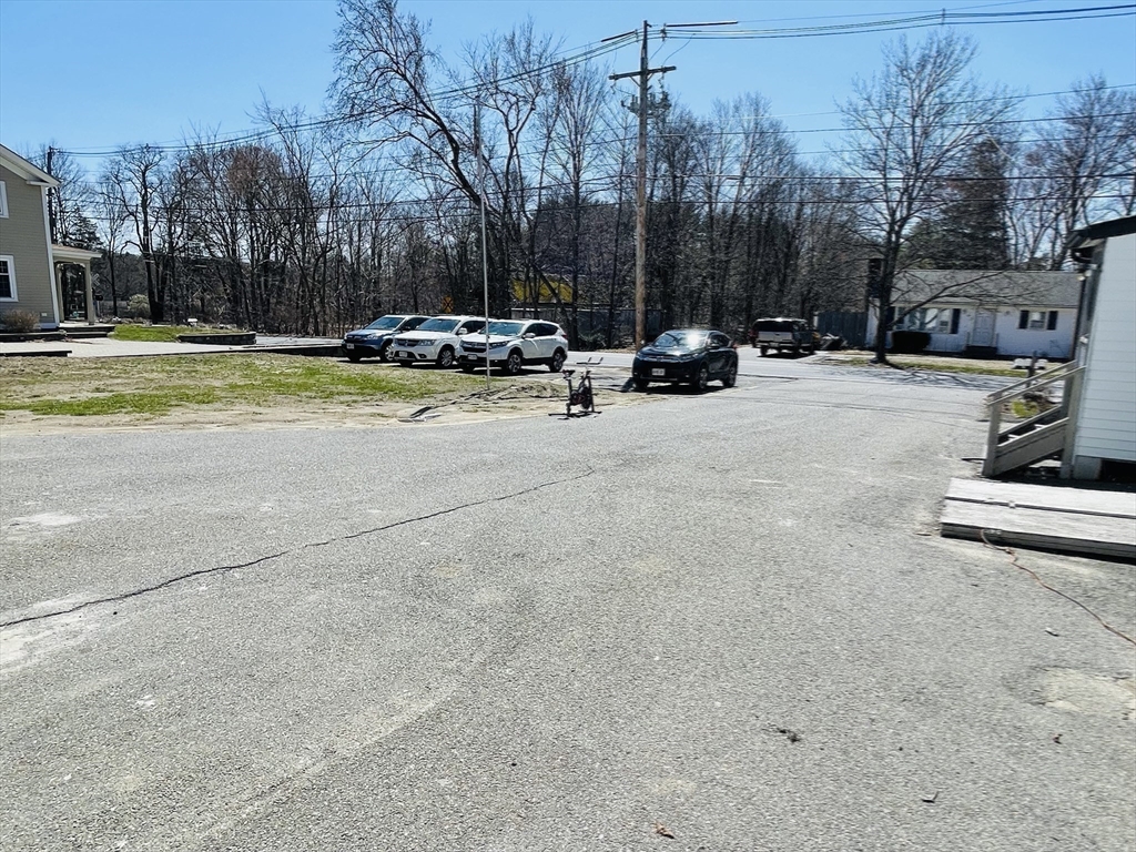 92 Mill Street Lancaster, MA 01523 - Photo 25 of 26 a view of a street with houses on both side of it