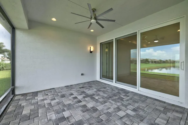 a large living room with stainless steel appliances granite countertop furniture and a wooden floor