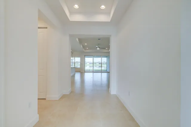 a view of kitchen with kitchen island stainless steel appliances refrigerator sink and stove