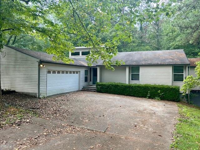 162 Lake Forest Drive Acworth, GA 30102 - Photo 1 of 1 a view of a house with a yard and garage