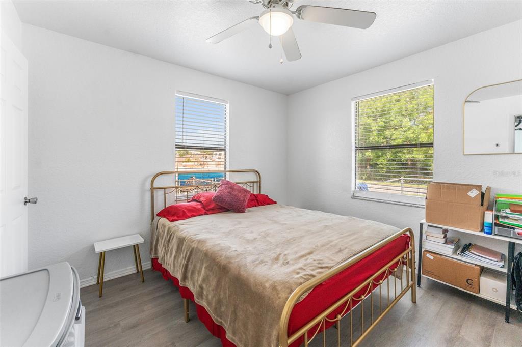 652 North Jackson Street Eagle Lake, FL 33839 - Photo 15 of 30 a bedroom with a bed and a desk